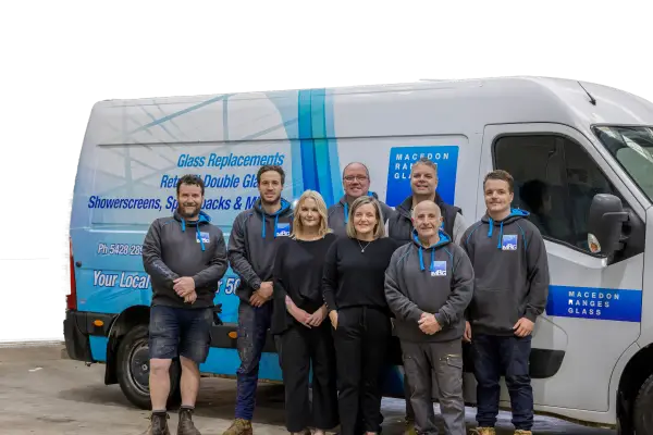 Macedon Ranges Glazing team standing in front of MRG van